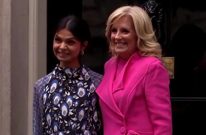  Jill Biden Arrives in London in $1,200 Dior Heels and Bright Pink Outfit as Feeble Joe Stays Behind (VIDEO)